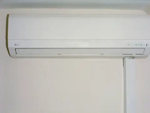 A split air conditioner mounted on a white wall